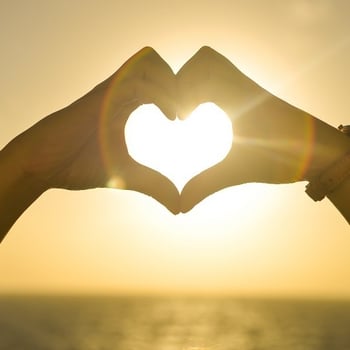 A pair of hands forming a love heart, illustrating me love for marketers.