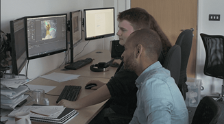 Morgan working on his GIF with our motion graphics designer Troy.